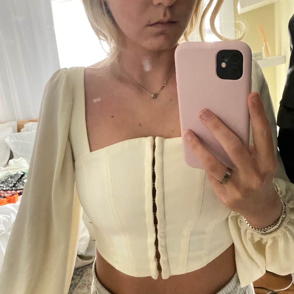 Urban outfitters cream long sleeve top. Hooks along the front.